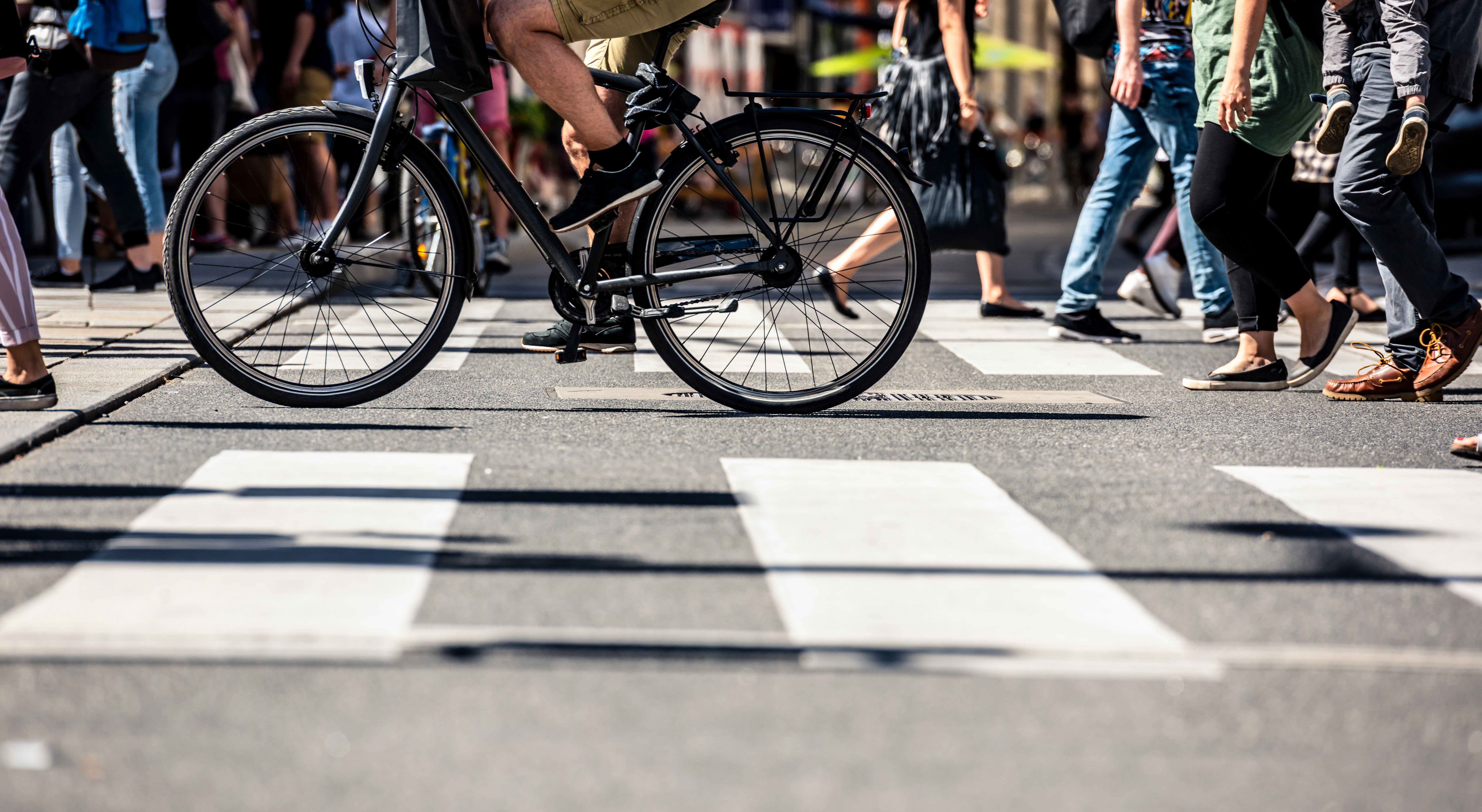 People on pedestrian crossings, on foot and by bicycle